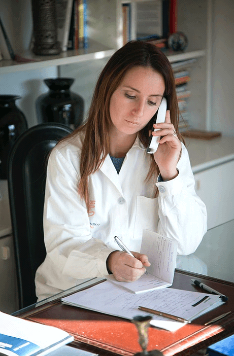 Medical Excuse Note/A doctor fills out a Medical Excuse Note for a patient's work absence
